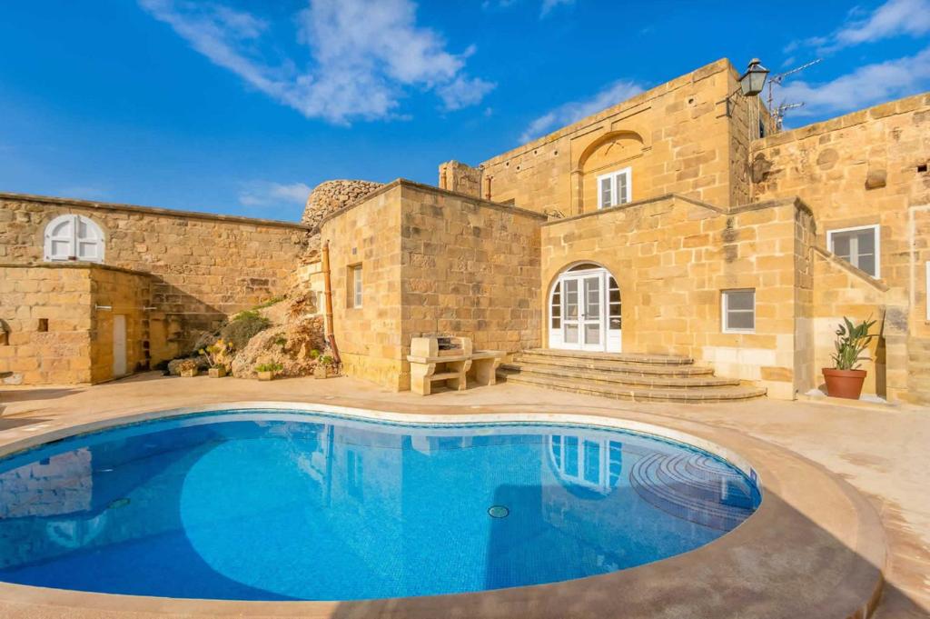Πισίνα στο ή κοντά στο Gharilma V Holiday Home