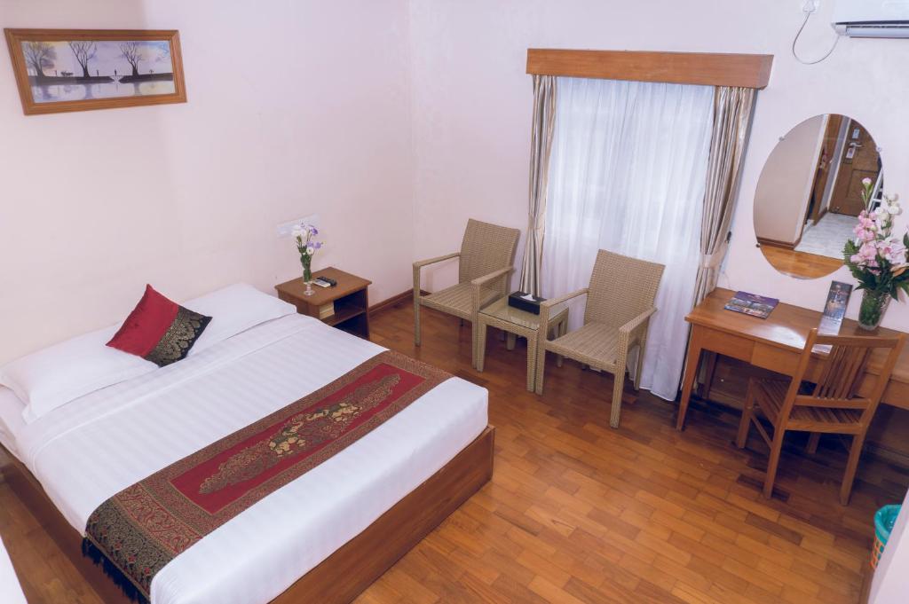 Voodi või voodid majutusasutuse Hotel Sidney toas