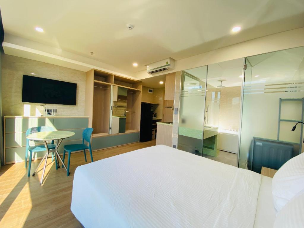 TV a/nebo společenská místnost v ubytování NAM Hotel & Residences
