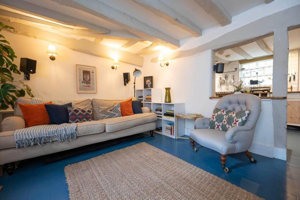 a living room with a couch and a chair at Linden Grove - 2 Bed City Centre Cottage in Kent