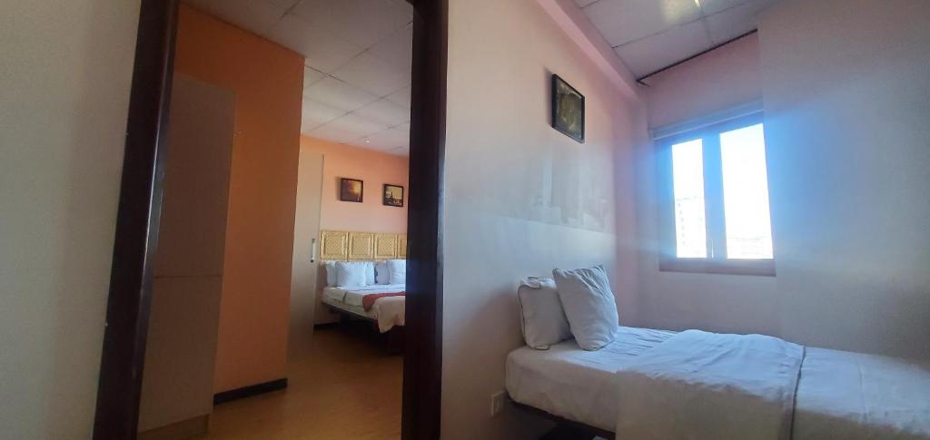Uma cama ou camas num quarto em Hotel Cristal Madagascar