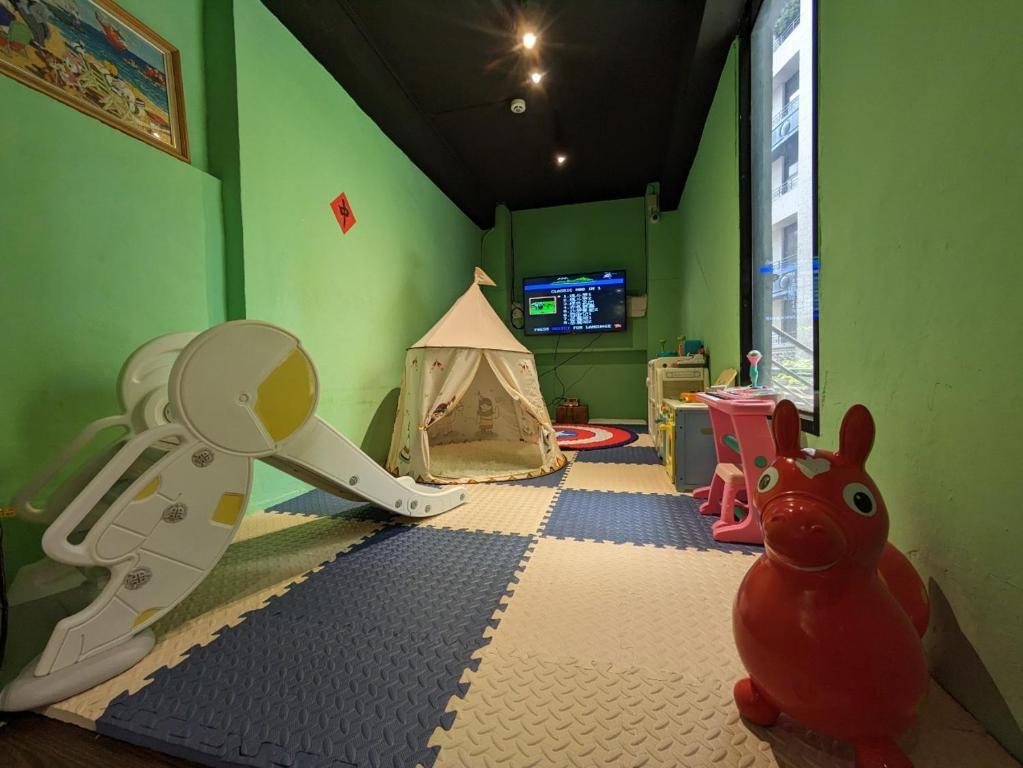 a childs room with a play room with a play set at Cho Hotel in Taipei