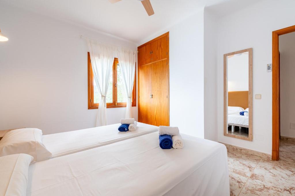 A bed or beds in a room at Finca Bosc de Can Alou by Mallorca House Rent