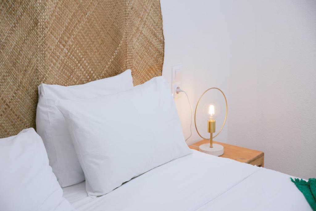 A bed or beds in a room at Die Zwei Brüder Art & Suites