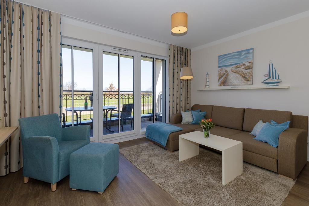 Posezení v ubytování Aparthotel Waterkant Suites - Fewos am Meer mit SPA