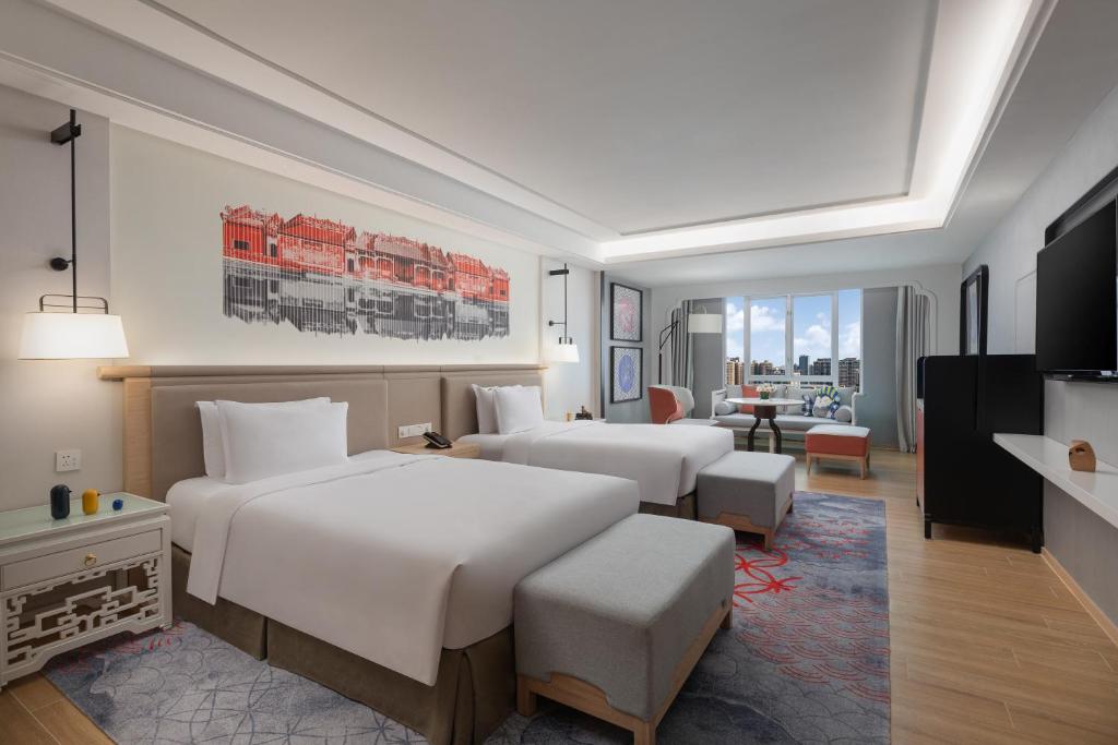 Postel nebo postele na pokoji v ubytování voco Guangzhou Shifu by IHG