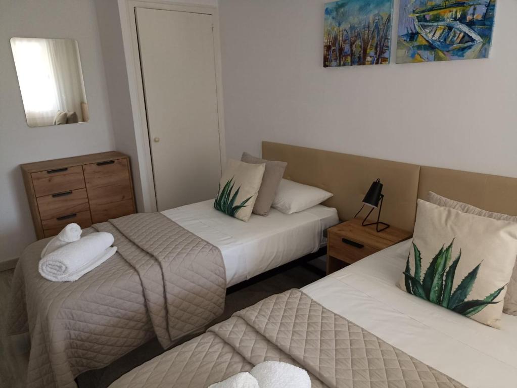 Posteľ alebo postele v izbe v ubytovaní Apartamento Maya Relax Salou