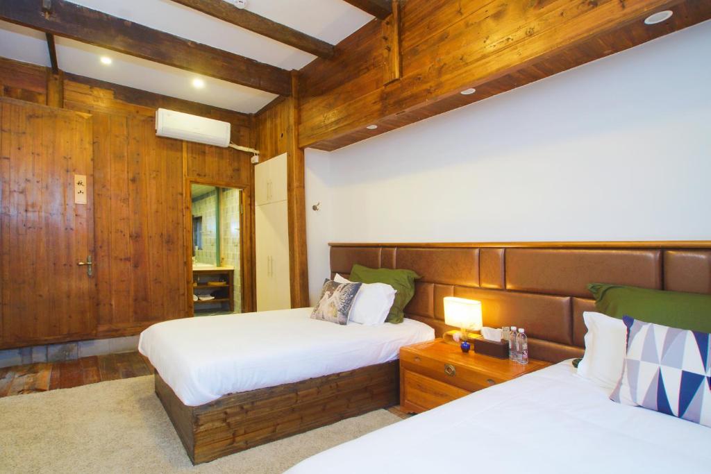 Postel nebo postele na pokoji v ubytování Alina Garden Boutique Resort Huangshan Hongcun