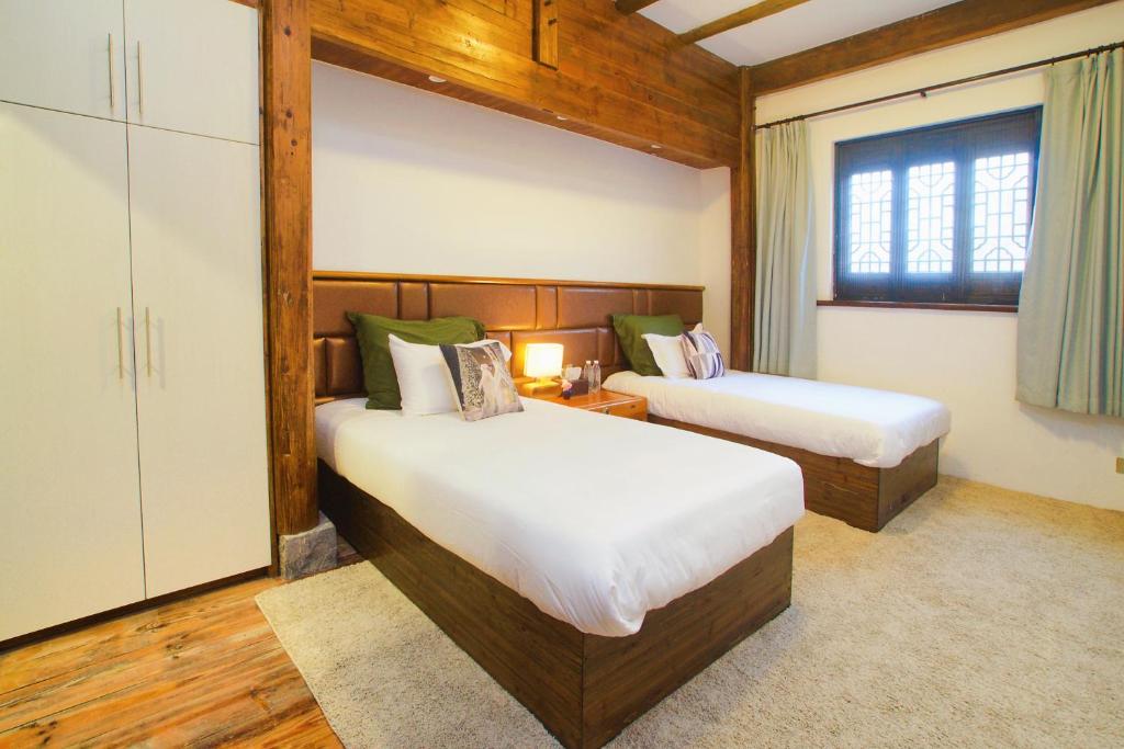 Postel nebo postele na pokoji v ubytování Alina Garden Boutique Resort Huangshan Hongcun