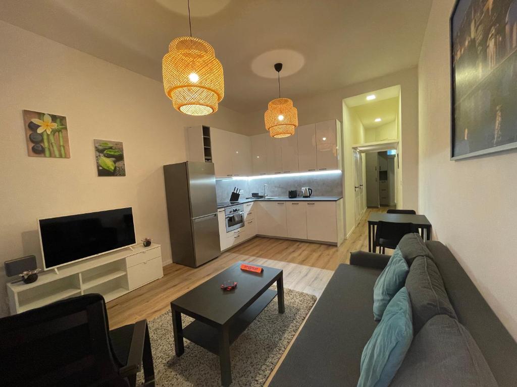 TV a/nebo společenská místnost v ubytování Andrews Cosy Apartment