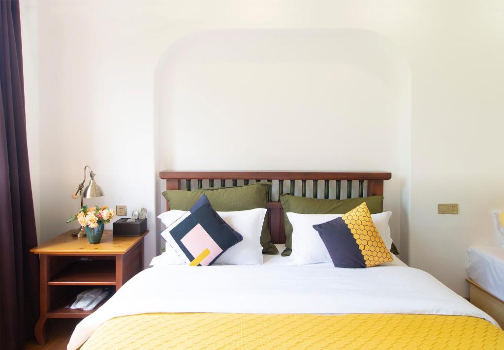 Postel nebo postele na pokoji v ubytování Alina Garden Boutique Resort Huangshan Hongcun