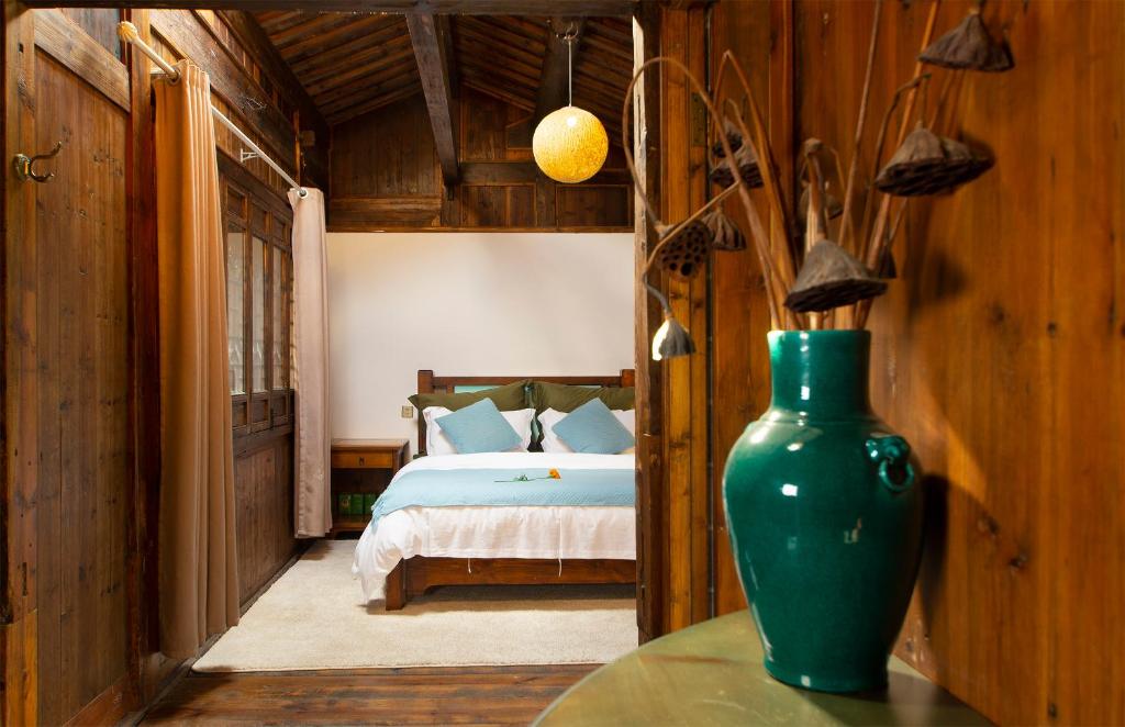 Postel nebo postele na pokoji v ubytování Alina Garden Boutique Resort Huangshan Hongcun