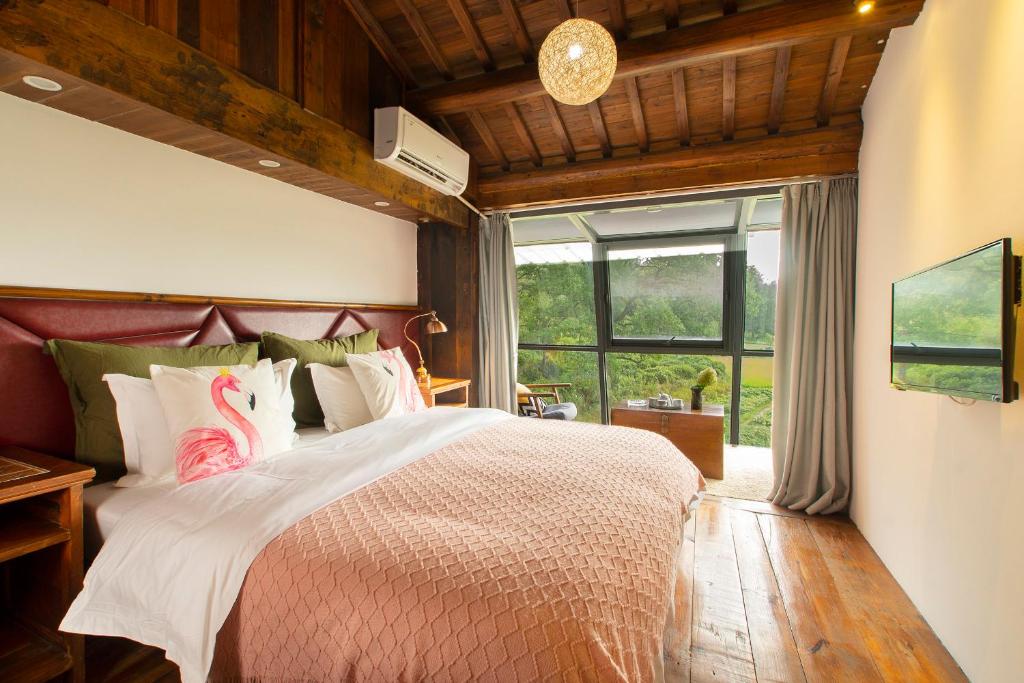 Postel nebo postele na pokoji v ubytování Alina Garden Boutique Resort Huangshan Hongcun