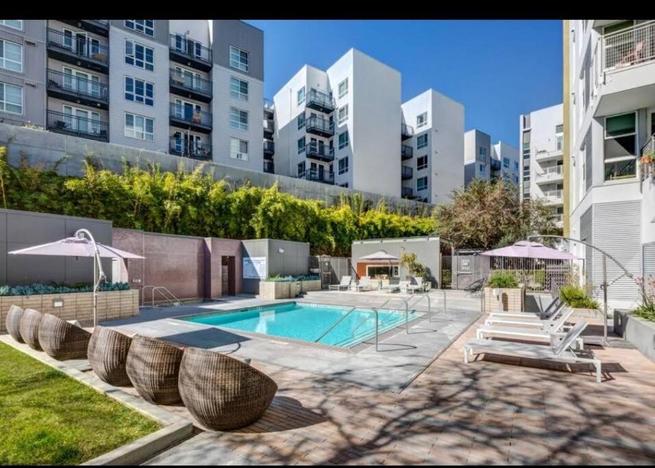 a swimming pool in the middle of a city with buildings at Lovely 3bed Apt with pool close to SD Convetion Center 324 in San Diego