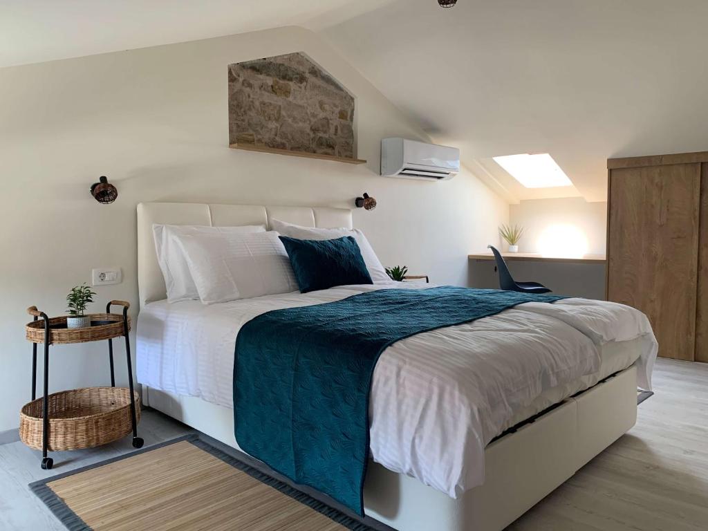 Ένα ή περισσότερα κρεβάτια σε δωμάτιο στο Casa Pozzetto