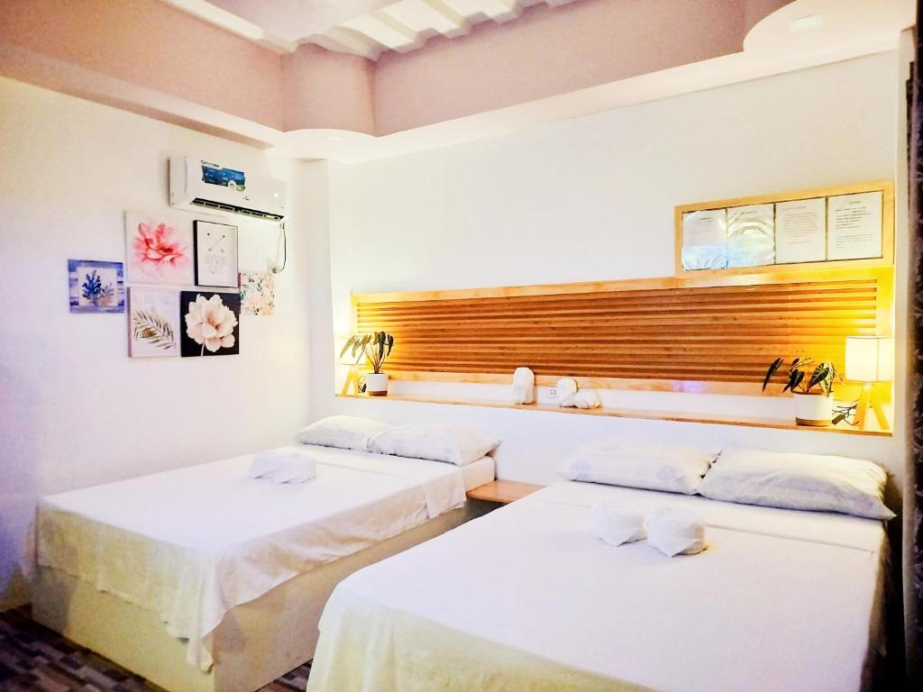 Postel nebo postele na pokoji v ubytování Swakihan Guest House