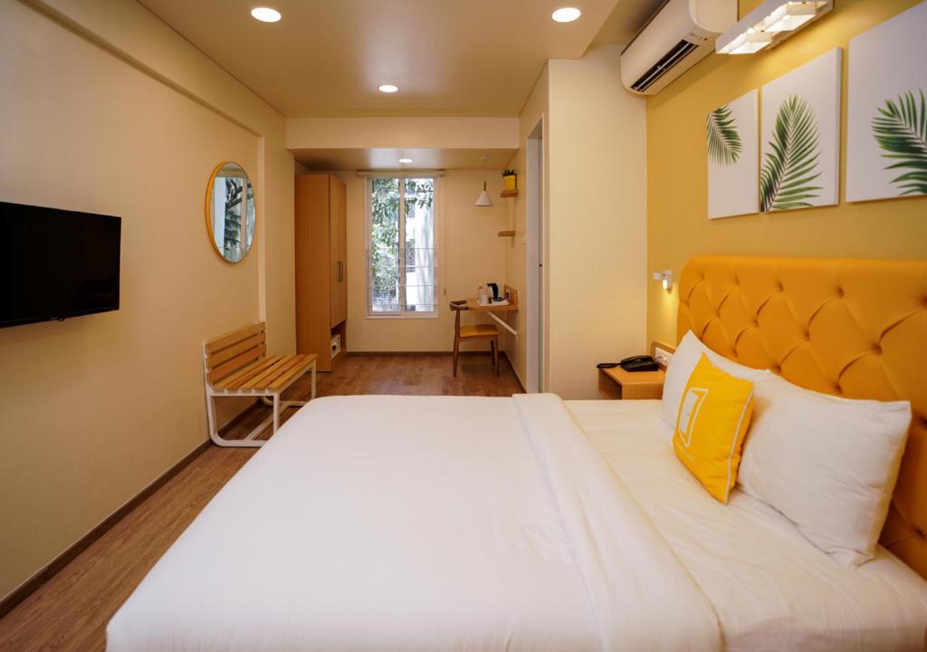 TV a/nebo společenská místnost v ubytování Bloom Hotel Koregaon Park