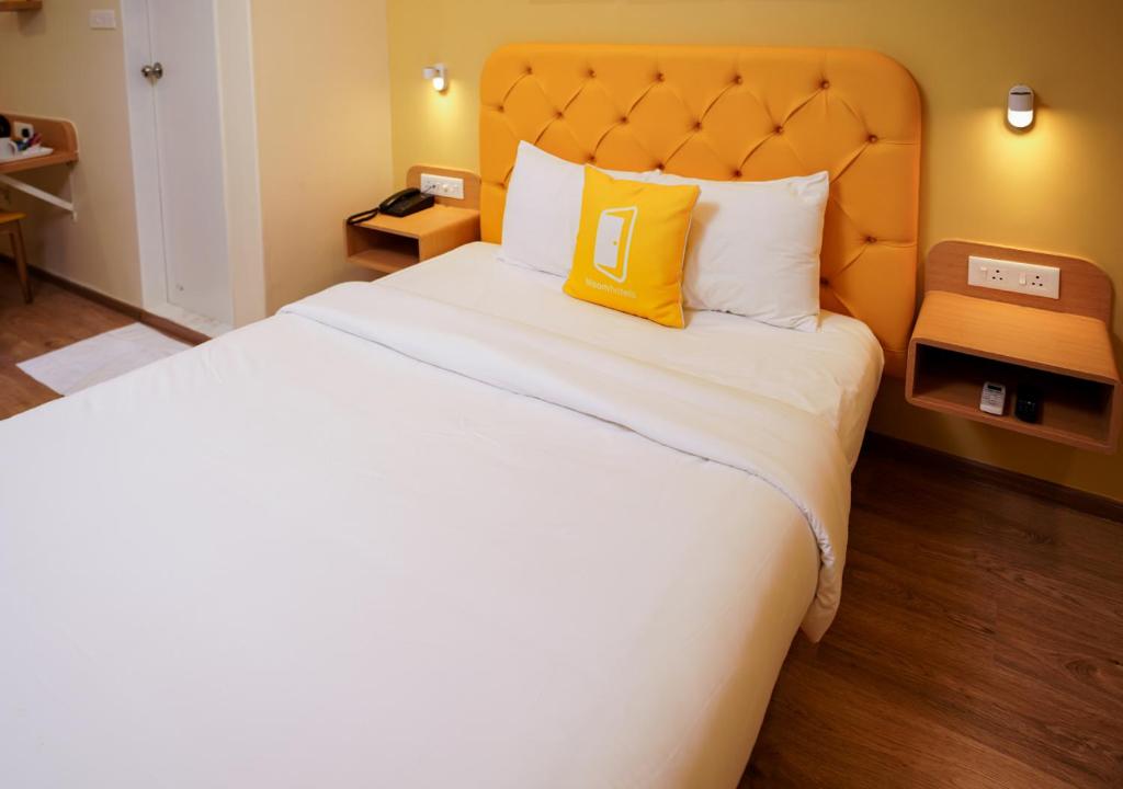 Postel nebo postele na pokoji v ubytování Bloom Hotel Koregaon Park