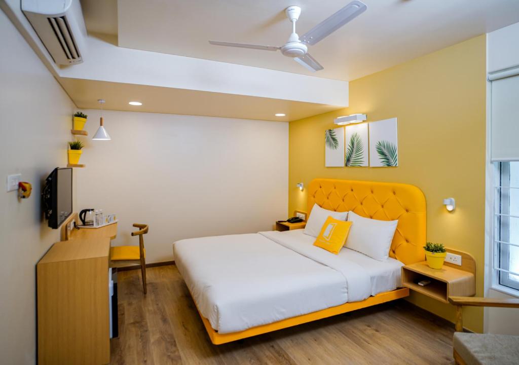 Postel nebo postele na pokoji v ubytování Bloom Hotel Koregaon Park