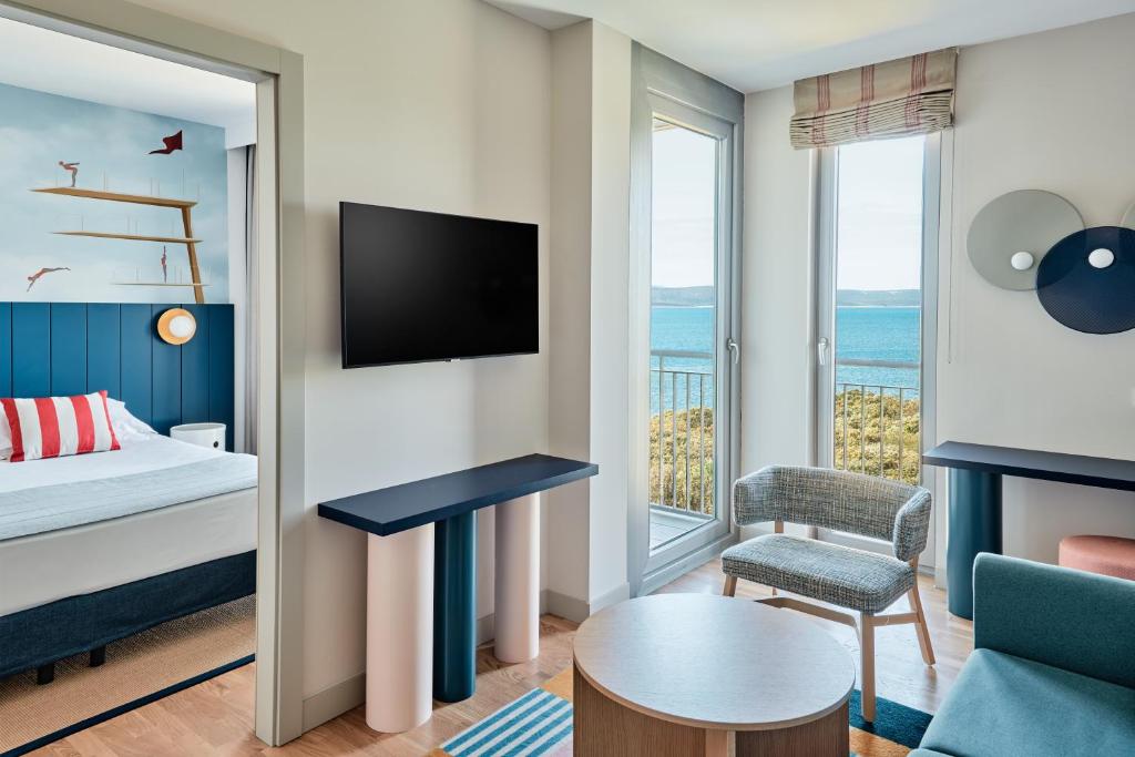 a junior suite with a view of the ocean at Falkensteiner Family Hotel Diadora in Zadar