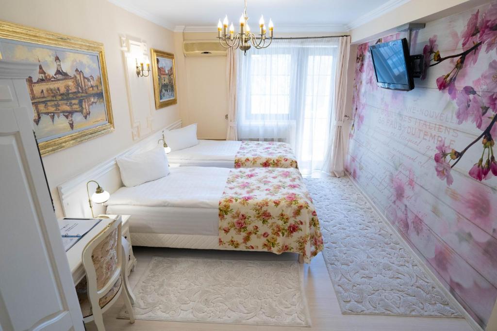 Postel nebo postele na pokoji v ubytování Villa Alice