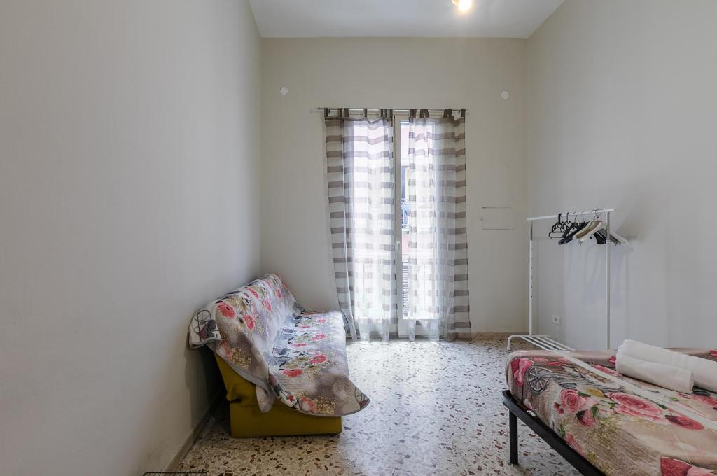 A bed or beds in a room at Palermo Central Apartment