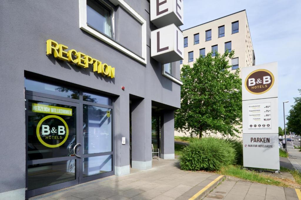 a facade of a building with a sign on the door at B&amp;B Hotel Heidelberg in Heidelberg