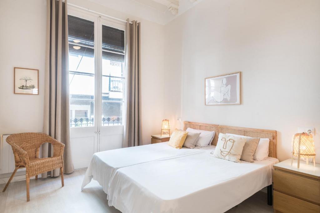Posteľ alebo postele v izbe v ubytovaní Cozy Apt with sunny terrace in the heart of Gracia