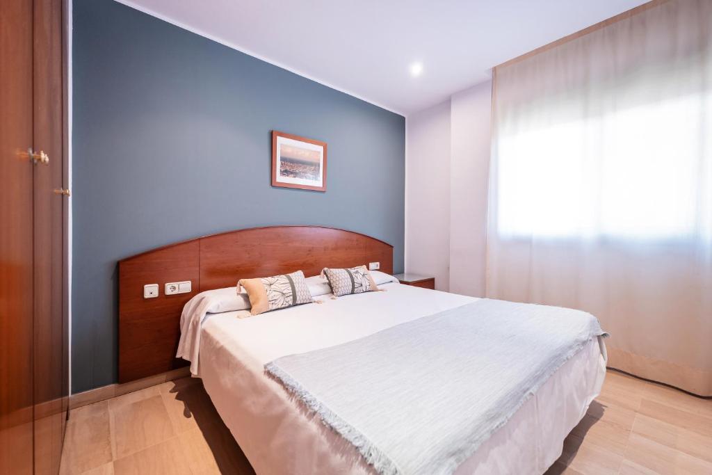 Posteľ alebo postele v izbe v ubytovaní Aparthotel Napols - Abapart