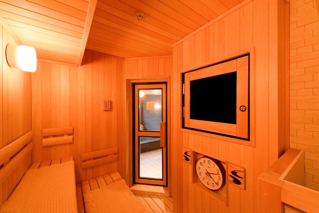 TV a/nebo společenská místnost v ubytování Shinrin Hotel