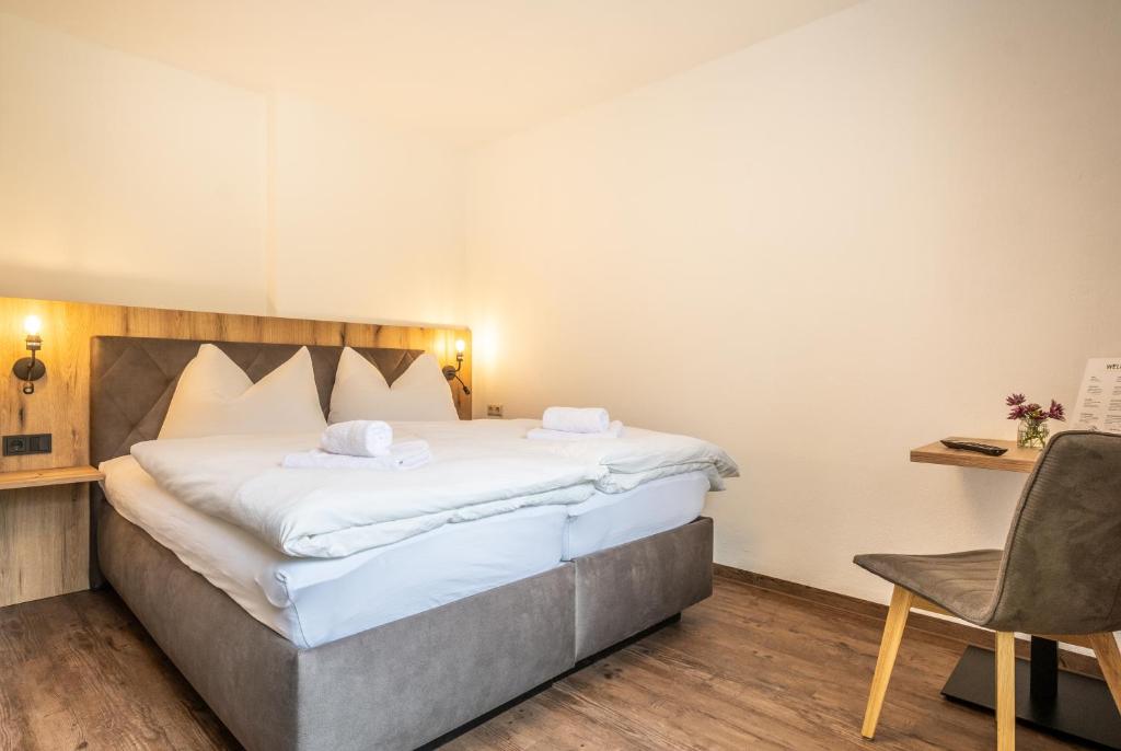 Postel nebo postele na pokoji v ubytování Alpha Apartments