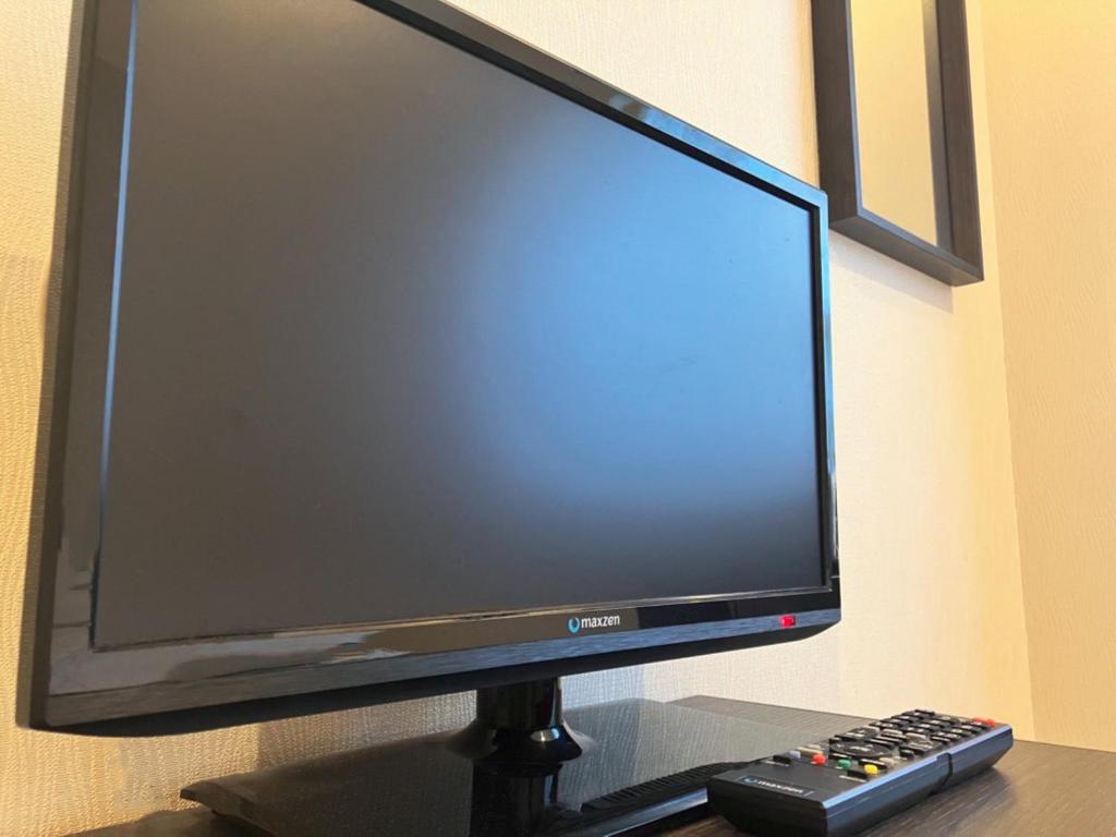 TV a/nebo společenská místnost v ubytování Shinjuku Sun Park Hotel