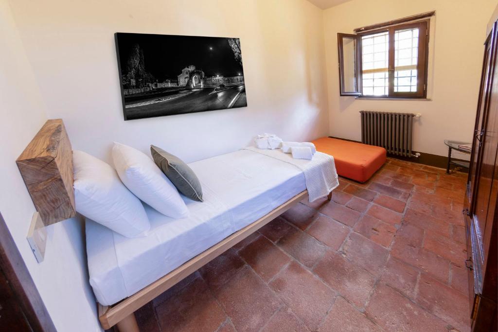 Postel nebo postele na pokoji v ubytování Frantoio Del Moscatello
