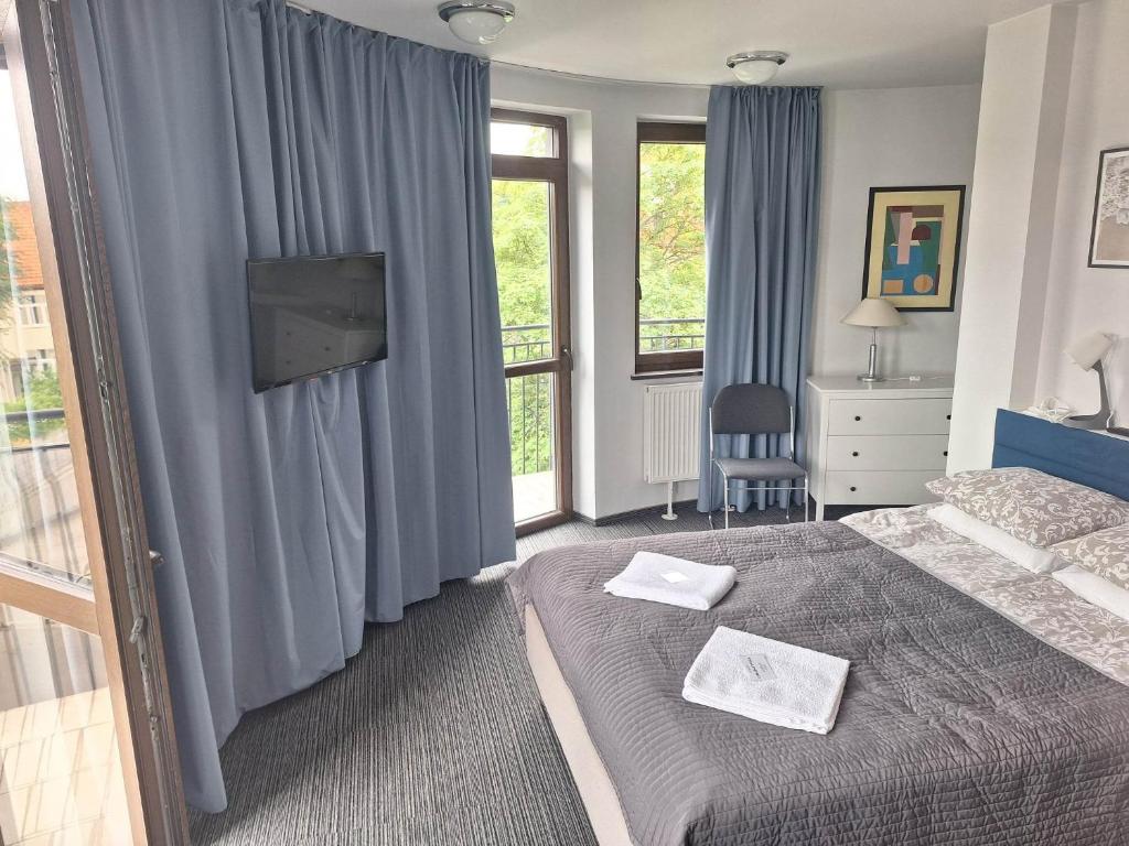 Posteľ alebo postele v izbe v ubytovaní B & B Tomula