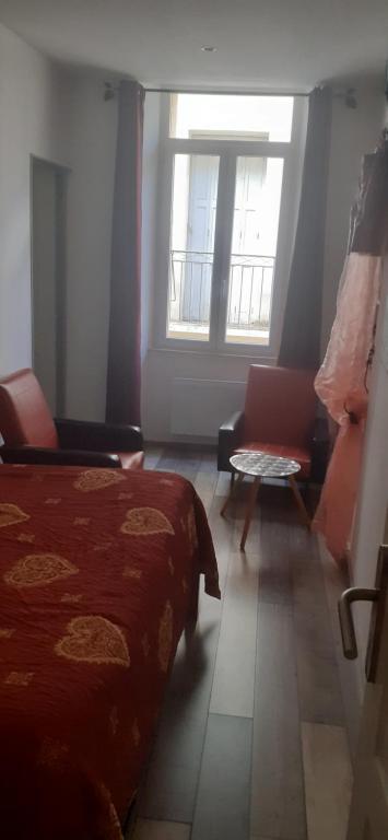 Postel nebo postele na pokoji v ubytování La Re'Belle