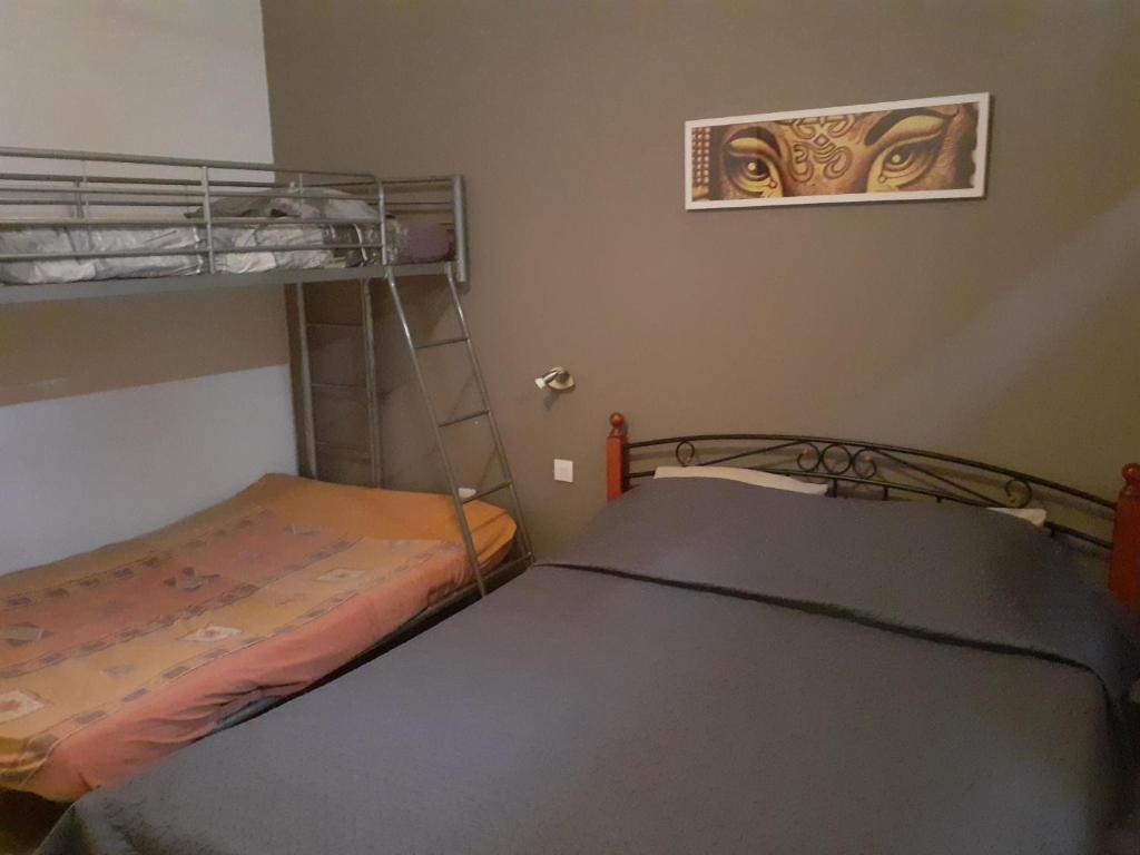 Postel nebo postele na pokoji v ubytování La Re'Belle