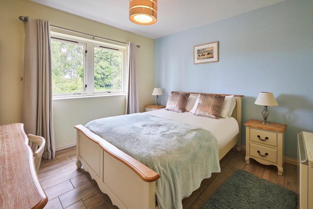 a bedroom with a bed and a window at Host & Stay - Sandpipers in Belford