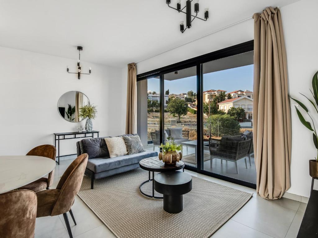 a living room with a couch and a table at Sanders Elgio in Limassol