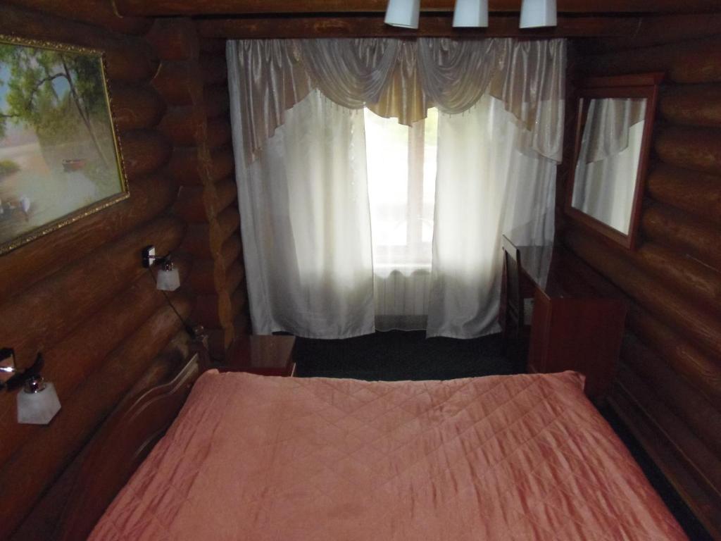 Postel nebo postele na pokoji v ubytování Tourist complex Karina