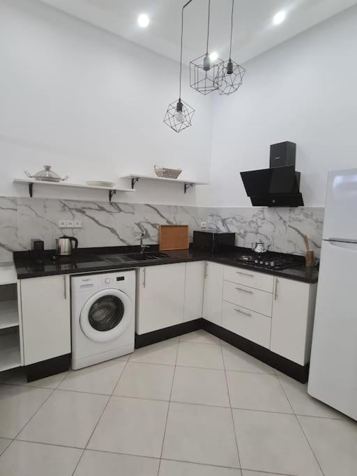 Kuchyň nebo kuchyňský kout v ubytování Appartement Sable blanc