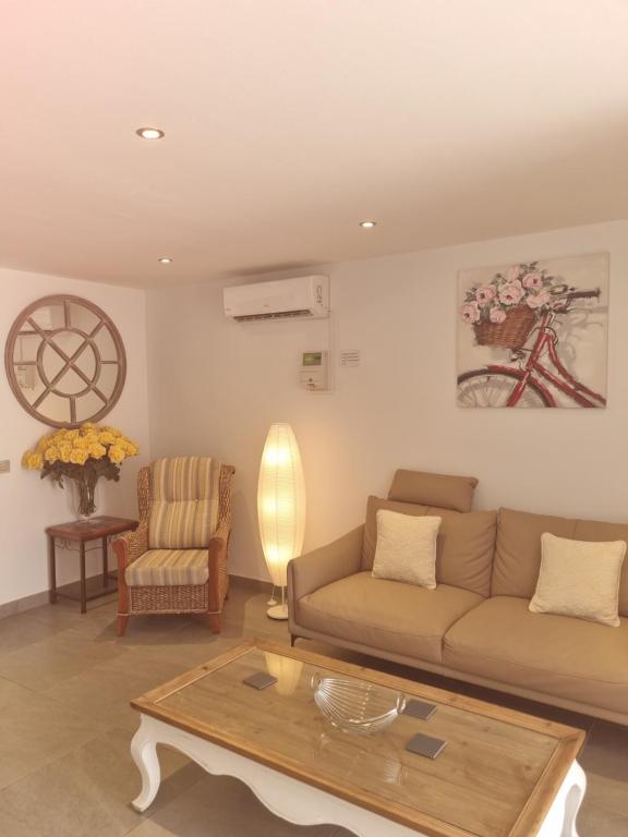 a living room with a couch and a coffee table at Lazydays in Puerto del Carmen