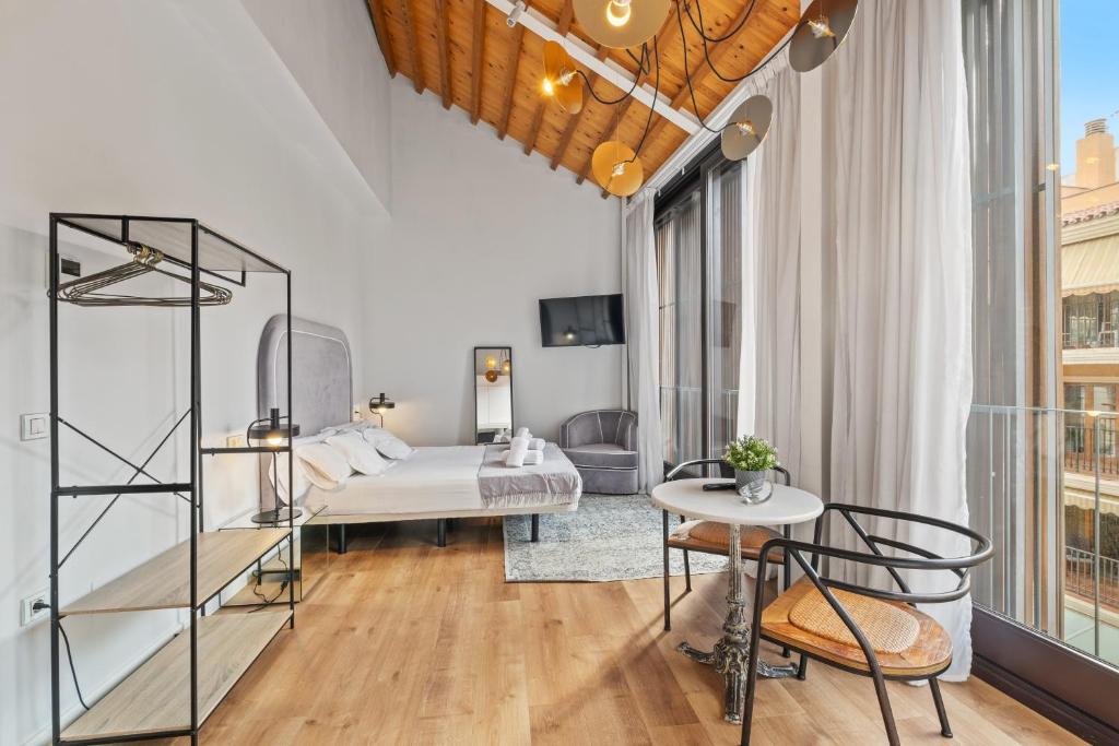 Posteľ alebo postele v izbe v ubytovaní Apartamentos Casapalma Centro Histórico