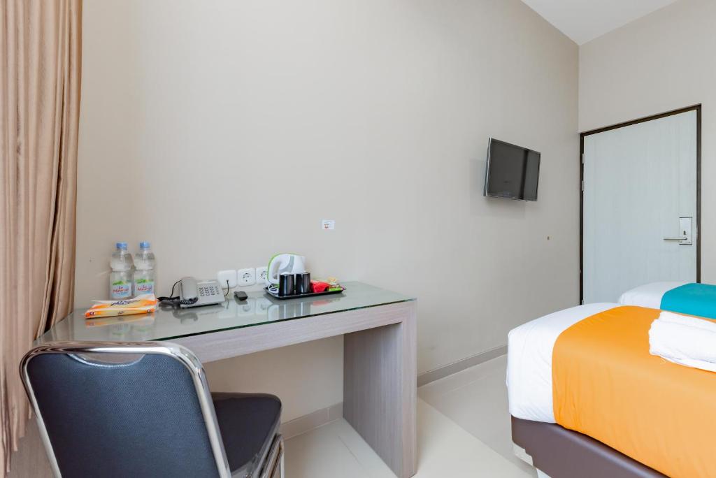 TV a/nebo společenská místnost v ubytování Sans Hotel Berau Square