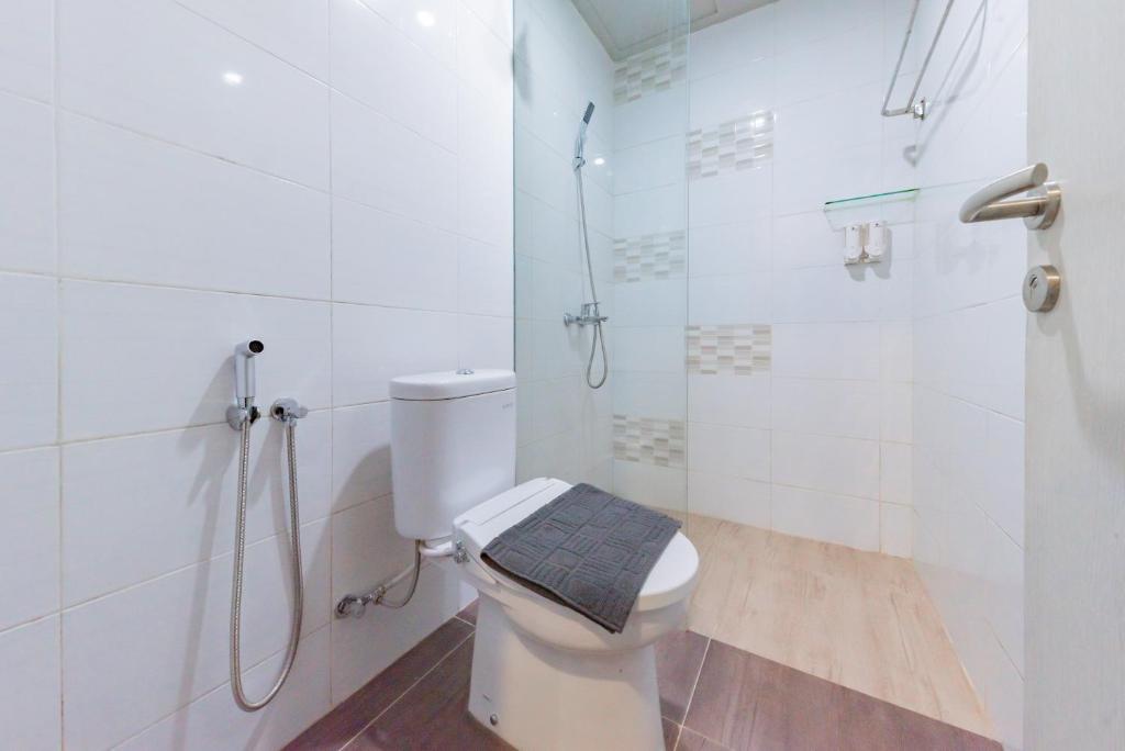 Koupelna v ubytování Sans Hotel Berau Square