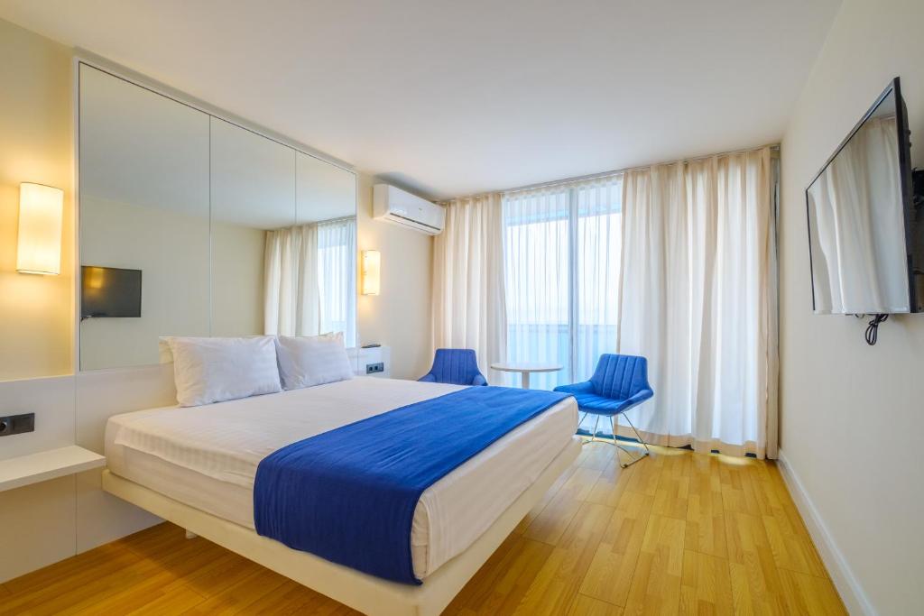 Postel nebo postele na pokoji v ubytování Orbi City Hotel Official D Block