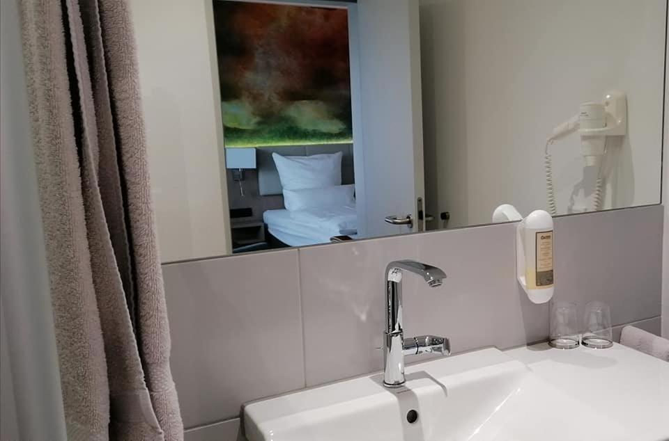 Koupelna v ubytování Thermalhotel Kemper