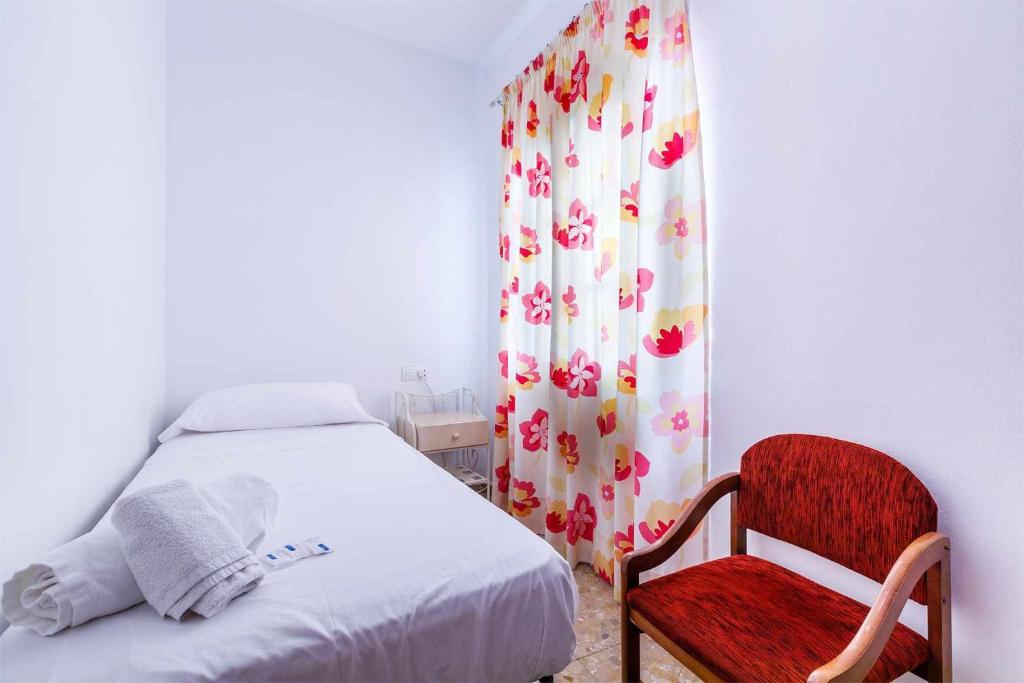 Łóżko lub łóżka w pokoju w obiekcie A&N Casa del Sol