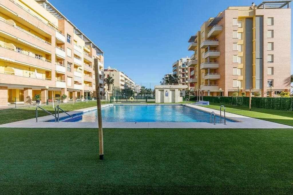 a swimming pool in the middle of a building at A&N La Vega 2 in Torre del Mar