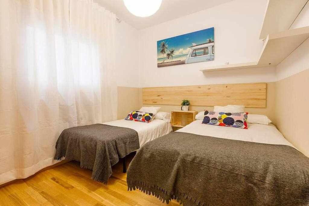 Postel nebo postele na pokoji v ubytování A&N La Vega 2