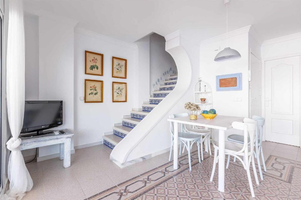 A television and/or entertainment centre at A&N Atico Downtown Torre del Mar